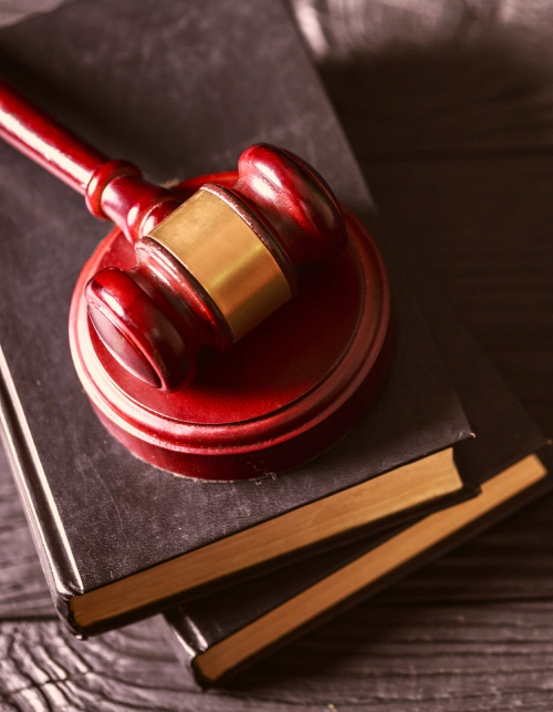 law books and red gavel on top price ut